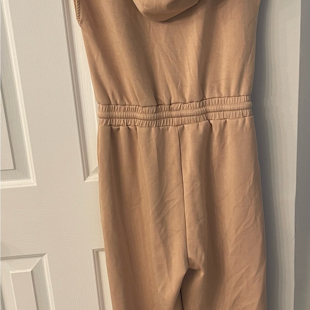 Tan hooded jumpsuit.